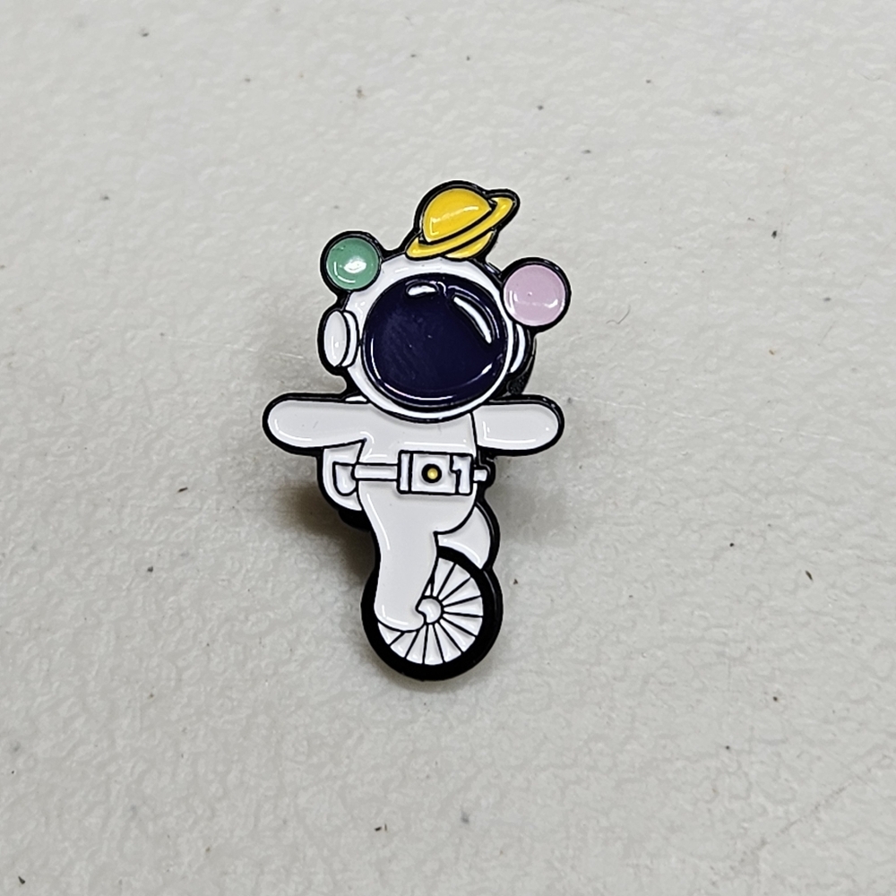 Spaceman Juggling Enamel Pin